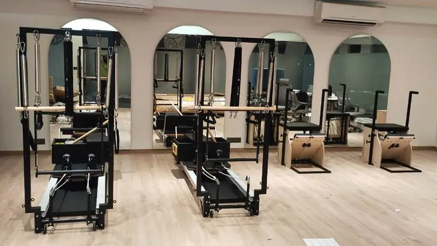Pilates studio with reformer and chair equipment